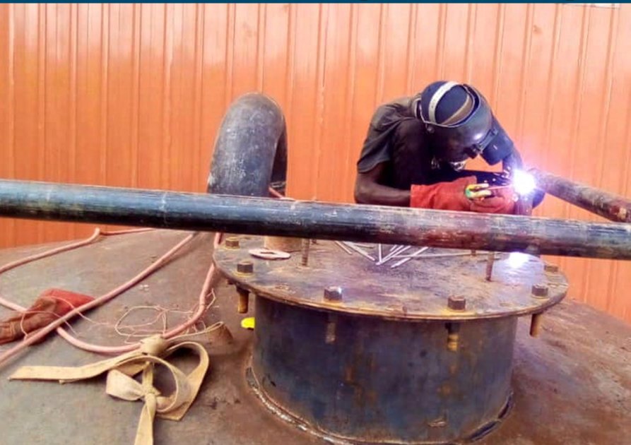 Water tank fitting and plumbing